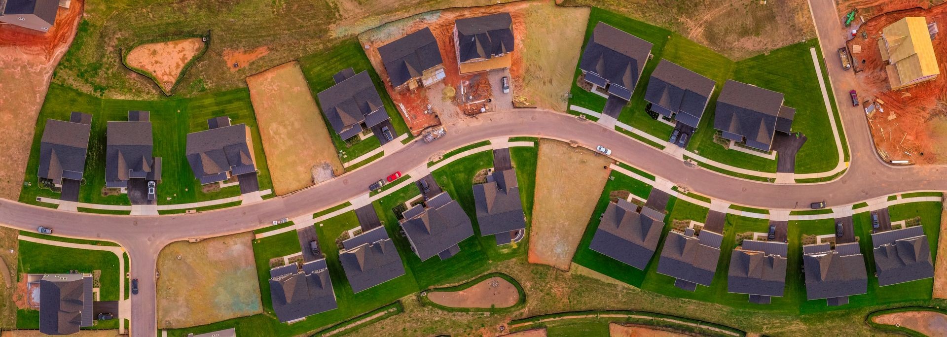 New construction neighborhood aerial panorama of American single family home real estate